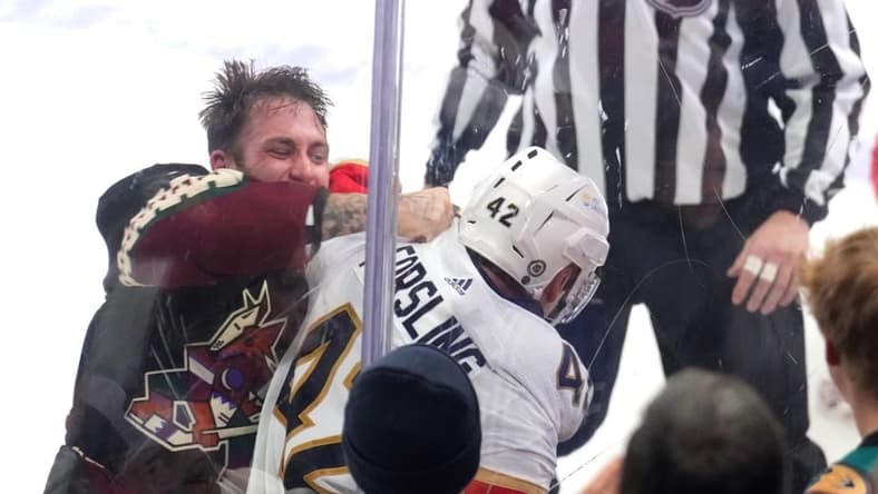 Jan 2, 2024; Tempe, Arizona, USA; Arizona Coyotes left wing Jason Zucker (16) fights Florida Panthers defenseman Gustav Forsling (42) during the second period at Mullett Arena. Mandatory Credit: Joe Camporeale-USA TODAY Sports