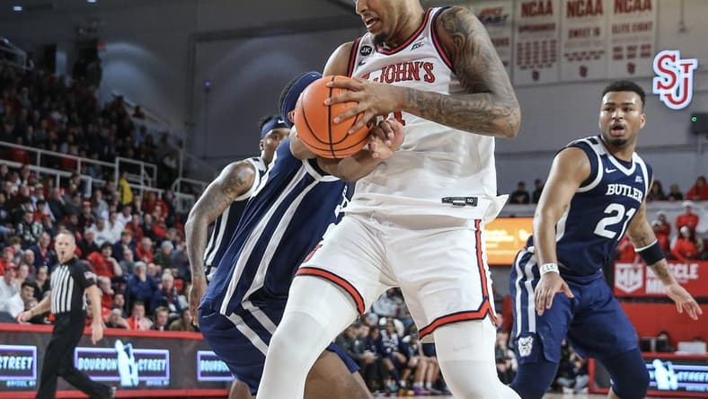 Jan 2, 2024; Queens, New York, USA; St. John's Red Storm center Joel Soriano (11) grabs a rebound in the second half against the Butler Bulldogs at Carnesecca Arena. Mandatory Credit: Wendell Cruz-USA TODAY Sports