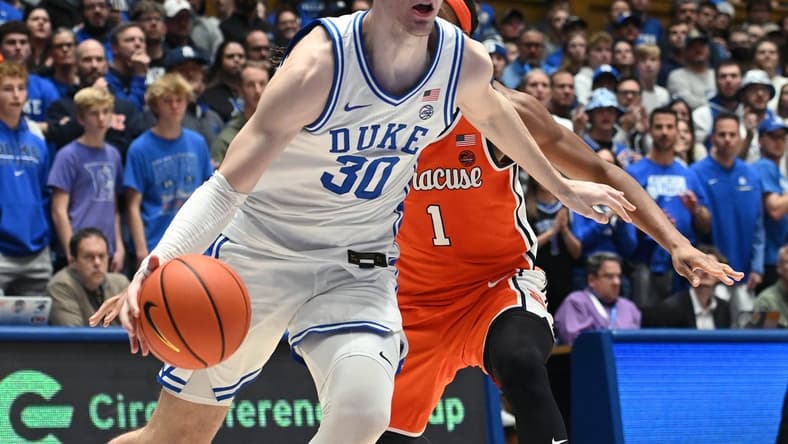 Jan 2, 2024; Durham, North Carolina, USA; Duke Blue Devils center Kyle Filipowski (30) drives to the basket as Syracuse Orange forward Maliq Brown (1) defends during the second half at Cameron Indoor Stadium. The Blue Devils won 86-66. Mandatory Credit: Rob Kinnan-USA TODAY Sports