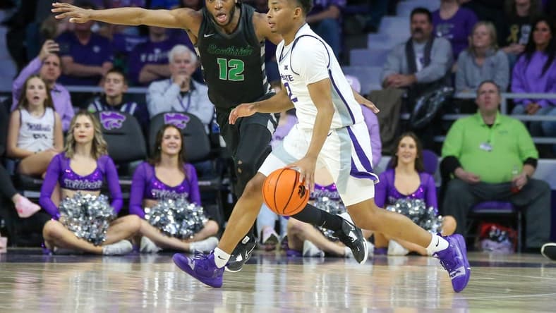 Jan 2, 2024; Manhattan, Kansas, USA; Kansas State Wildcats guard Tylor Perry (2) is guarded by Chicago State Cougars guard Brent Davis (12) during the second half at Bramlage Coliseum. Mandatory Credit: Scott Sewell-USA TODAY Sports
