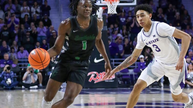 Jan 2, 2024; Manhattan, Kansas, USA; Chicago State Cougars guard Wesley Cardet, Jr.(1) dribbles by Kansas State Wildcats guard Dorian Finister (3) during the second half at Bramlage Coliseum. Mandatory Credit: Scott Sewell-USA TODAY Sports