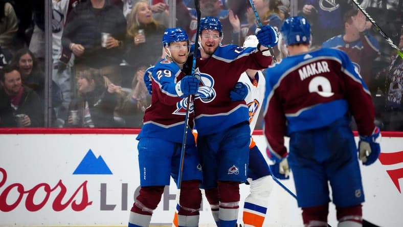 Jan 2, 2024; Denver, Colorado, USA; Colorado Avalanche right wing Valeri Nichushkin (13) celebrates his goal with center Nathan MacKinnon (29) in the third period against the New York Islanders at Ball Arena. Mandatory Credit: Ron Chenoy-USA TODAY Sports
