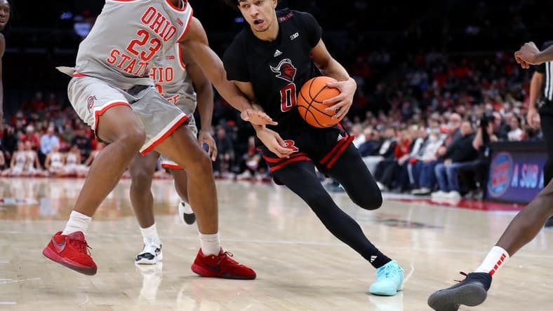 Jan 3, 2024; Columbus, Ohio, USA; Rutgers Scarlet Knights guard Derek Simpson (0) controls the ball as Ohio State Buckeyes forward Zed Key (23) defends during the first half at Value City Arena. Mandatory Credit: Joseph Maiorana-USA TODAY Sports
