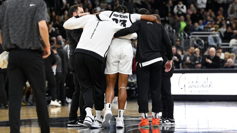Jan 3, 2024; Providence, Rhode Island, USA; Providence Friars forward Bryce Hopkins (23) is helped by staff after getting injured during the second half against the Seton Hall Pirates at Amica Mutual Pavilion. Mandatory Credit: Eric Canha-USA TODAY Sports