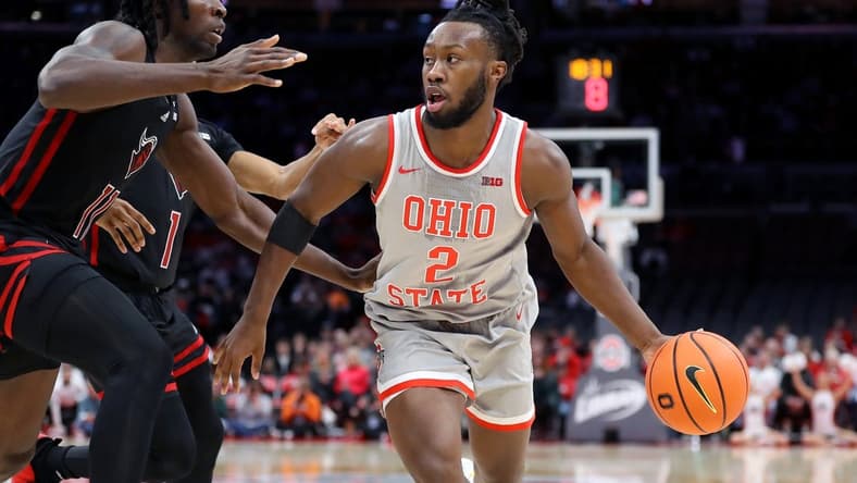 Jan 3, 2024; Columbus, Ohio, USA; Ohio State Buckeyes guard Bruce Thornton (2) dribbles the ball as Rutgers Scarlet Knights center Clifford Omoruyi (11) defends during the second half at Value City Arena. Mandatory Credit: Joseph Maiorana-USA TODAY Sports
