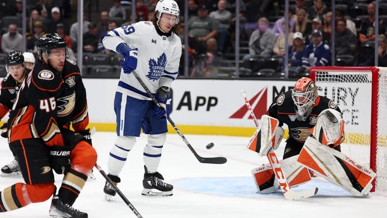 Jan 3, 2024; Anaheim, California, USA; Anaheim Ducks goaltender Lukas Dostal (1) blocks a shot during the first period against the Toronto Maple Leafs at Honda Center. Mandatory Credit: Kiyoshi Mio-USA TODAY Sports