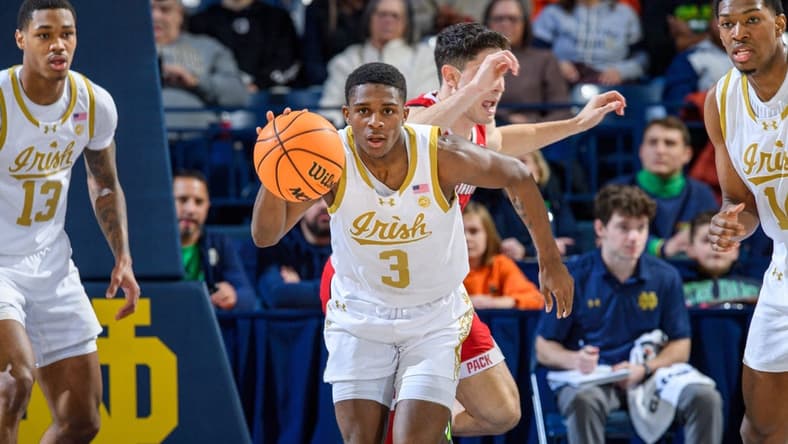 Jan 3, 2024; South Bend, Indiana, USA; Notre Dame Fighting Irish guard Markus Burton (3) dribbles in the first half against the North Carolina State Wolfpack at the Purcell Pavilion. Mandatory Credit: Matt Cashore-USA TODAY Sports