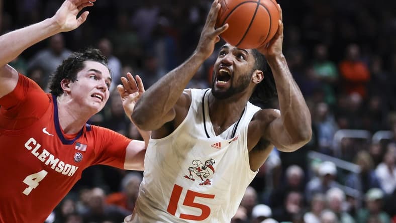 Jan 3, 2024; Coral Gables, Florida, USA; Miami Hurricanes forward Norchad Omier (15) drives to the basket against Clemson Tigers forward Ian Schieffelin (4) during the second half at Watsco Center. Mandatory Credit: Sam Navarro-USA TODAY Sports