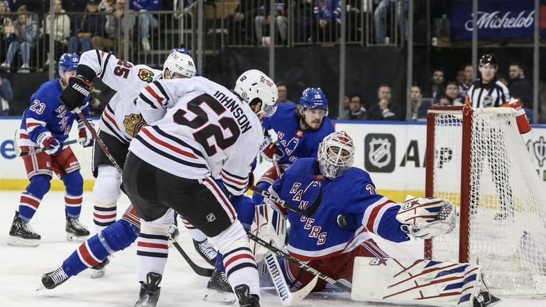 Jan 4, 2024; New York, New York, USA; New York Rangers goaltender Igor Shesterkin (31) makes a save on a shot on goal attempt by Chicago Blackhawks center Reese Johnson (52) at Madison Square Garden. Mandatory Credit: Wendell Cruz-USA TODAY Sports