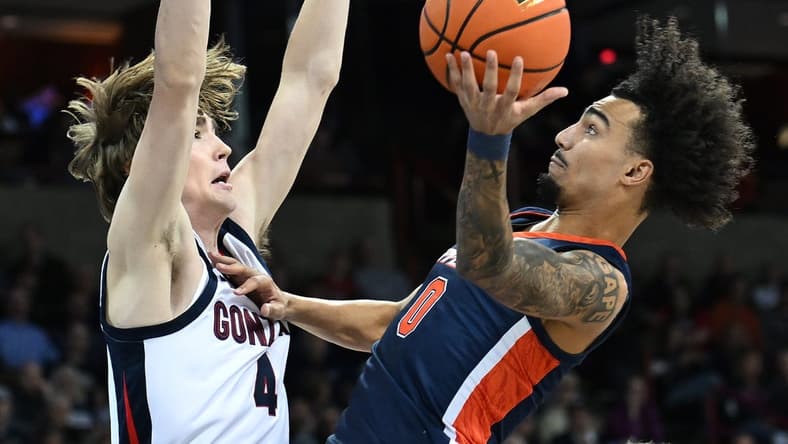 Jan 4, 2024; Spokane, Washington, USA; Pepperdine Waves guard Houston Mallette (0) shoots the ball against Gonzaga Bulldogs guard Dusty Stromer (4) in the first half at Spokane Arena. Mandatory Credit: James Snook-USA TODAY Sports