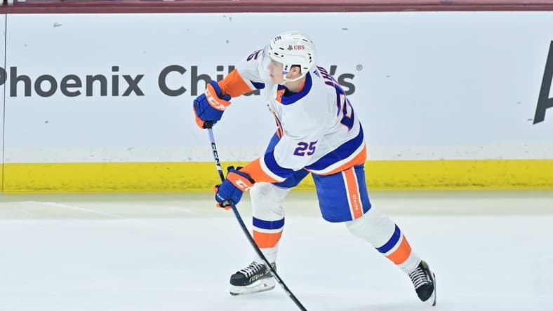 Jan 4, 2024; Tempe, Arizona, USA; New York Islanders defenseman Sebastian Aho (25) passes the puck in the first period against the Arizona Coyotes at Mullett Arena. Mandatory Credit: Matt Kartozian-USA TODAY Sports
