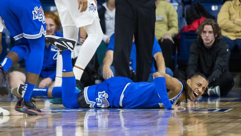 Jan 4, 2024; Tulsa, Oklahoma, USA; Memphis Tigers guard Caleb Mills (9) grimaces in pain after injuring his knee during the first half against the Tulsa Golden Hurricane at the Reynolds Center. The Memphis Tigers won the game 78-75. Mandatory Credit: Brett Rojo-USA TODAY Sports