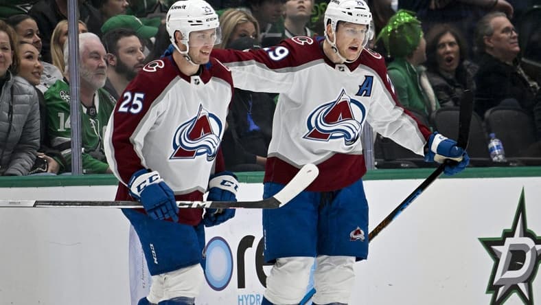 Jan 4, 2024; Dallas, Texas, USA; Colorado Avalanche right wing Logan O'Connor (25) and center Nathan MacKinnon (29) celebrates the game winning goal scored by MacKinnon during the overtime period against the Dallas Stars at the American Airlines Center. Mandatory Credit: Jerome Miron-USA TODAY Sports