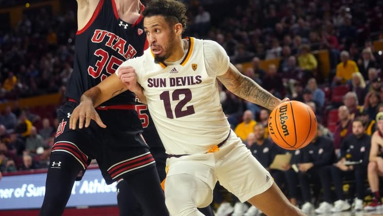 Jan 4, 2024; Tempe, Arizona, USA; ASU Sun Devils guard Jose Perez (12) drives past Utah Utes center Branden Carlson (35) at Desert Financial Arena.