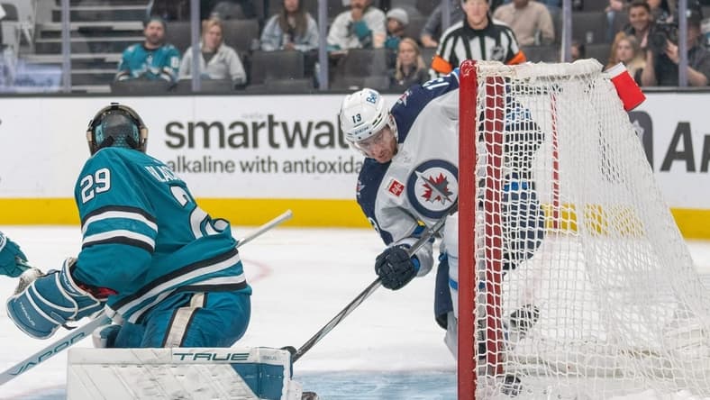 Jan 4, 2024; San Jose, California, USA; Winnipeg Jets center Gabriel Vilardi (13) deflects the puck into the goal during the third period against San Jose Sharks goaltender Mackenzie Blackwood (29) at SAP Center at San Jose. Mandatory Credit: Stan Szeto-USA TODAY Sports