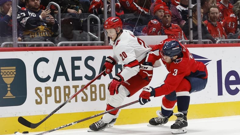 Jan 5, 2024; Washington, District of Columbia, USA; Carolina Hurricanes center Sebastian Aho (20) skates with the puck as Washington Capitals defenseman Nick Jensen (3) chases in the second period at Capital One Arena. Mandatory Credit: Geoff Burke-USA TODAY Sports
