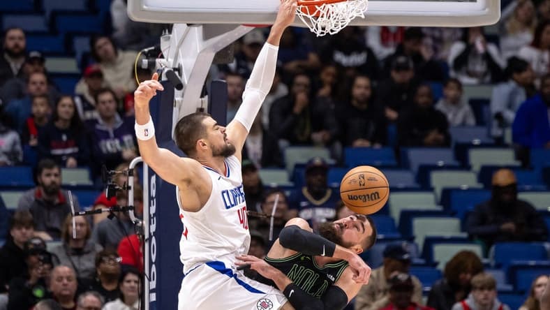 Jan 5, 2024; New Orleans, Louisiana, USA;  LA Clippers center Ivica Zubac (40) dunks the ball against New Orleans Pelicans center Jonas Valanciunas (17) during the first half at Smoothie King Center. Mandatory Credit: Stephen Lew-USA TODAY Sports