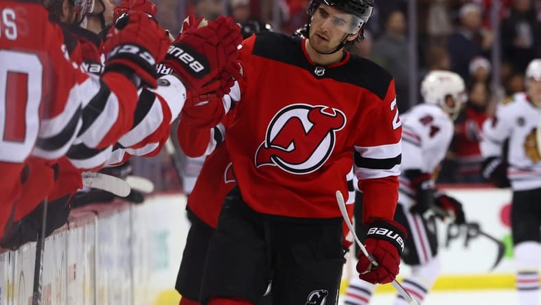 Jan 5, 2024; Newark, New Jersey, USA; New Jersey Devils center Michael McLeod (20) celebrates his goal against the Chicago Blackhawks during the third period at Prudential Center. Mandatory Credit: Ed Mulholland-USA TODAY Sports