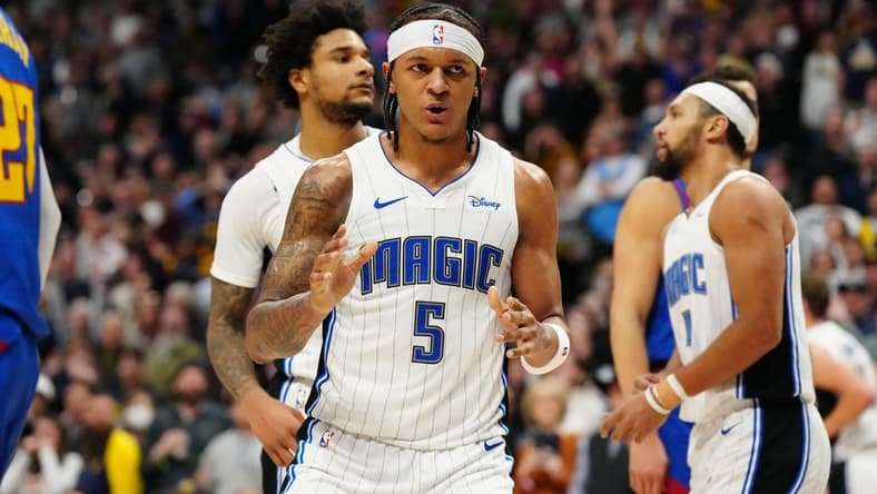 Jan 5, 2024; Denver, Colorado, USA; Orlando Magic forward Paolo Banchero (5) reacts in the fourth quarter against the Denver Nuggets at Ball Arena. Mandatory Credit: Ron Chenoy-USA TODAY Sports