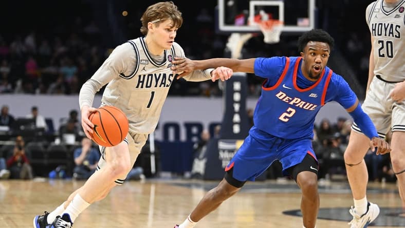Jan 6, 2024; Washington, District of Columbia, USA; Georgetown Hoyas guard Rowan Brumbaugh (1) dribbles as DePaul Blue Demons guard Chico Carter Jr. (2) defends during the first half at Capital One Arena. Mandatory Credit: Brad Mills-USA TODAY Sports