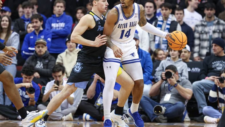 Jan 6, 2024; Newark, New Jersey, USA; Seton Hall Pirates guard Dre Davis (14) dribbles against Marquette Golden Eagles guard Tyler Kolek (11) during the first half at Prudential Center. Mandatory Credit: Vincent Carchietta-USA TODAY Sports