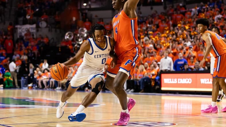 Jan 6, 2024; Gainesville, Florida, USA; Kentucky Wildcats guard Rob Dillingham (0) moves to the basket against Florida Gators forward Tyrese Samuel (4) during the first half at Exactech Arena at the Stephen C. O'Connell Center. Mandatory Credit: Matt Pendleton-USA TODAY Sports