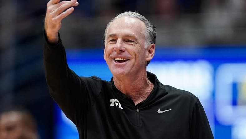 Jan 6, 2024; Lawrence, Kansas, USA; TCU Horned Frogs head coach Jamie Dixon reacts during the first half against the TCU Horned Frogs at Allen Fieldhouse. Mandatory Credit: Jay Biggerstaff-USA TODAY Sports