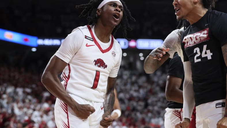 Jan 6, 2024; Fayetteville, Arkansas, USA; Arkansas Razorbacks guard Keyon Menifield Jr (1) celebrates after making a three point shot in the first half against the Auburn Tigers at Bud Walton Arena. Mandatory Credit: Nelson Chenault-USA TODAY Sports