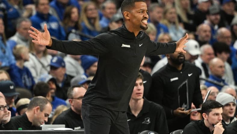 Jan 6, 2024; Omaha, Nebraska, USA; Providence Friars head coach Kim English watches action against the Creighton Bluejays in the first half at CHI Health Center Omaha. Mandatory Credit: Steven Branscombe-USA TODAY Sports