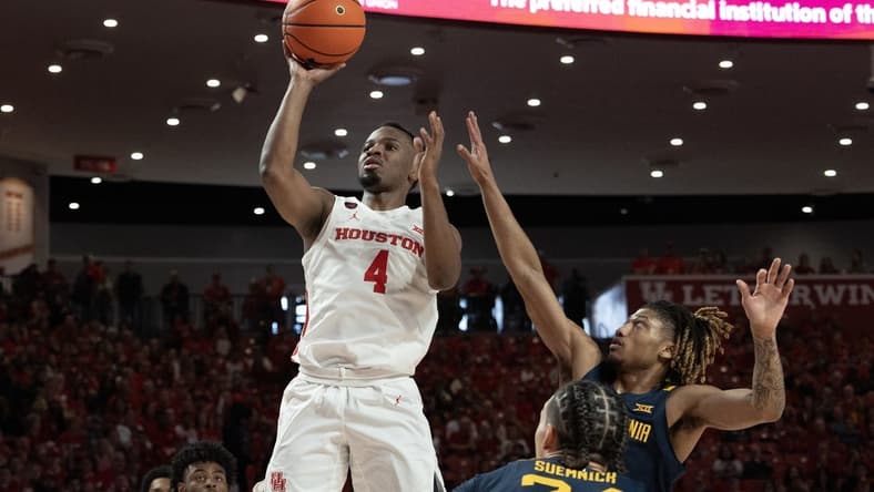Jan 6, 2024; Houston, Texas, USA; Houston Cougars guard L.J. Cryer (4) shoots against West Virginia Mountaineers guard Noah Farrakhan (1) in the first half at Fertitta Center. Mandatory Credit: Thomas Shea-USA TODAY Sports