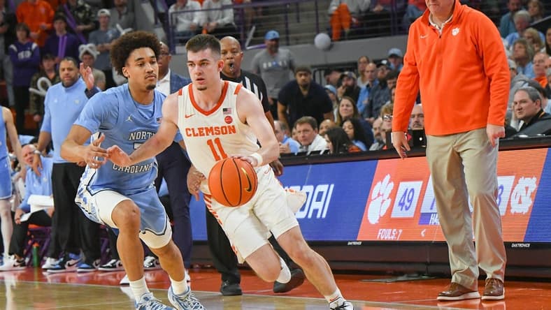 Jan 6, 2024; Clemson, South Carolina, USA; Clemson graduate Joseph Girard III dribbles near University of North Carolina guard Seth Trimble (7) during the second half at Littlejohn Coliseum. Mandatory Credit: Ken Ruinard-USA TODAY Sports