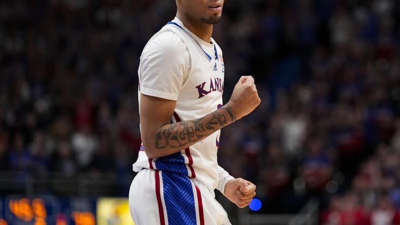 Jan 6, 2024; Lawrence, Kansas, USA; Kansas Jayhawks guard Dajuan Harris Jr. (3) celebrates after scoring late in the second half against the TCU Horned Frogs at Allen Fieldhouse. Mandatory Credit: Jay Biggerstaff-USA TODAY Sports