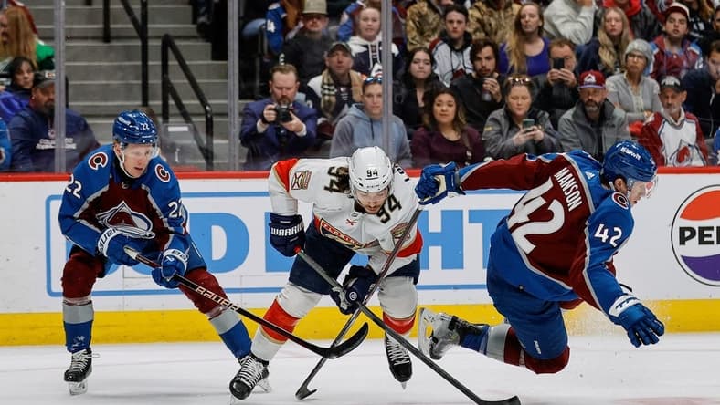 Jan 6, 2024; Denver, Colorado, USA; Florida Panthers left wing Ryan Lomberg (94) gets tied up with Colorado Avalanche left wing Fredrik Olofsson (22) and defenseman Josh Manson (42) in the first period at Ball Arena. Mandatory Credit: Isaiah J. Downing-USA TODAY Sports