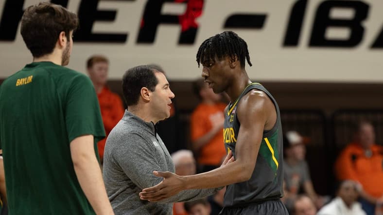 Jan 6, 2024; Stillwater, Okla, USA; Baylor Bears head coach Scott Drew talks with guard Ja'Kobe Walter (4) in the first half of an NCAA men  s basketball game against the Oklahoma State Cowboys at Gallagher-Iba arena. Mandatory Credit: Mitch Alcala-The Oklahoman