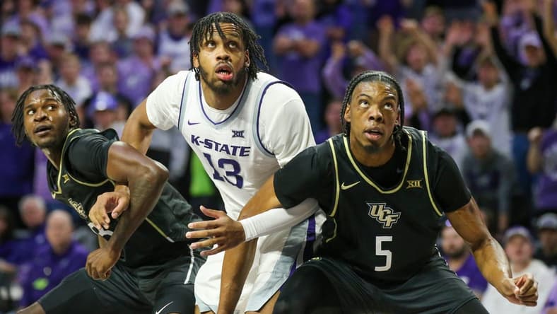 Jan 6, 2024; Manhattan, Kansas, USA; UCF Knights forwards Omar Payne (5) and Marchelus Avery (13) block out Kansas State Wildcats center Will McNair Jr. (13) for a rebound during the first half at Bramlage Coliseum. Mandatory Credit: Scott Sewell-USA TODAY Sports