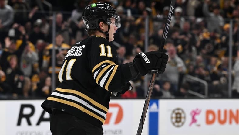 Jan 6, 2024; Boston, Massachusetts, USA; Boston Bruins center Trent Frederic (11) reacts after scoring a goal against the Tampa Bay Lightning during the first period at the TD Garden. Mandatory Credit: Brian Fluharty-USA TODAY Sports