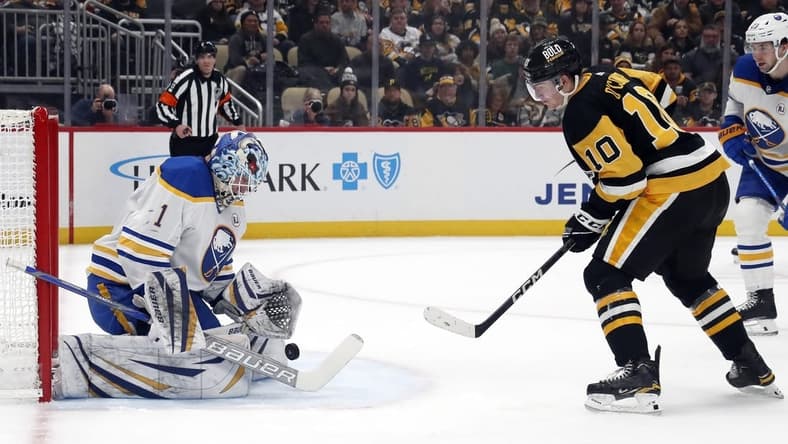 Jan 6, 2024; Pittsburgh, Pennsylvania, USA; Buffalo Sabres goaltender Ukko-Pekka Luukkonen (1) makes a save against Pittsburgh Penguins left wing Drew O'Connor (10) during the first period at PPG Paints Arena. Mandatory Credit: Charles LeClaire-USA TODAY Sports
