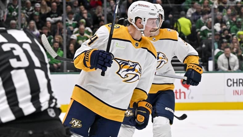Jan 6, 2024; Dallas, Texas, USA; Nashville Predators center Gustav Nyquist (14) celebrates after scoring a goal against the Dallas Stars during the first period at the American Airlines Center. Mandatory Credit: Jerome Miron-USA TODAY Sports