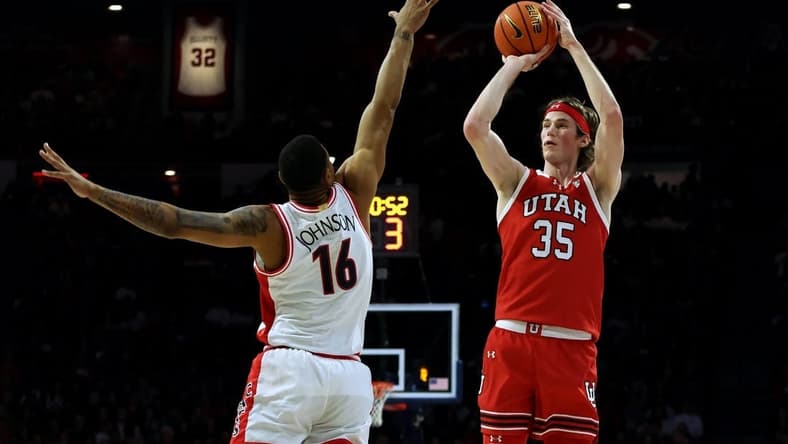 Jan 6, 2024; Tucson, Arizona, USA; Utah Utes center Branden Carlson (35) shoots a basket against Arizona Wildcats forward Keshad Johnson (16) during the first half at McKale Center. Mandatory Credit: Zachary BonDurant-USA TODAY Sports