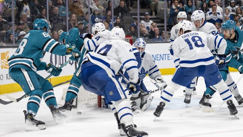 Jan 6, 2024; San Jose, California, USA; Toronto Maple Leafs goaltender Martin Jones (31) makes a save against San Jose Sharks center Mike Hoffman (68) during the second period at SAP Center at San Jose. Mandatory Credit: Neville E. Guard-USA TODAY Sports