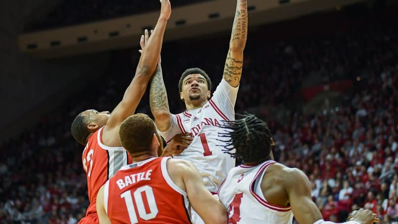 Jan 6, 2024; Bloomington, Indiana, USA; Indiana Hoosiers center Kel'el Ware (1) attempts a shot past Ohio State Buckeyes forward Zed Key (23) during the first half at Simon Skjodt Assembly Hall. Mandatory Credit: Robert Goddin-USA TODAY Sports