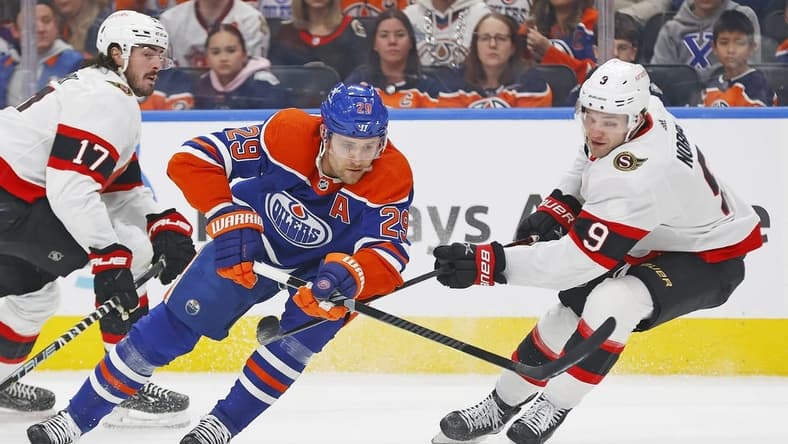 Jan 6, 2024; Edmonton, Alberta, CAN; Edmonton Oilers forward Leon Draisaitl (29) carries the puck around Ottawa Senators forward Josh Norris (9) during the first period at Rogers Place. Mandatory Credit: Perry Nelson-USA TODAY Sports