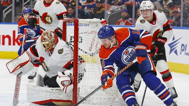 Jan 6, 2024; Edmonton, Alberta, CAN; Edmonton Oilers forward Zach Hyman (18) controls the puck against Ottawa Senators goaltender Anton Forsberg (31) during the first period at Rogers Place. Mandatory Credit: Perry Nelson-USA TODAY Sports