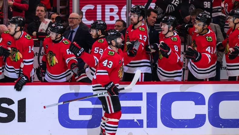 Jan 7, 2024; Chicago, Illinois, USA; Chicago Blackhawks center Colin Blackwell (43) celebrates his goal with teammates against the Calgary Flames during the first period at the United Center. Mandatory Credit: Daniel Bartel-USA TODAY Sports