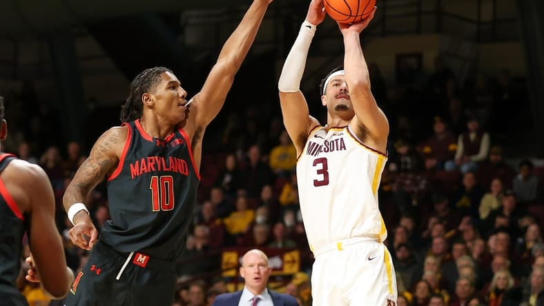 Jan 7, 2024; Minneapolis, Minnesota, USA; Minnesota Golden Gophers forward Dawson Garcia (3) shoots as Maryland Terrapins forward Julian Reese (10) defends during the first half at Williams Arena. Mandatory Credit: Matt Krohn-USA TODAY Sports