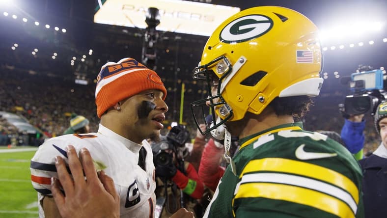 Jan 7, 2024; Green Bay, Wisconsin, USA; Chicago Bears quarterback Justin Fields (1) greets Green Bay Packers quarterback Jordan Love (10) following the game at Lambeau Field. Mandatory Credit: Jeff Hanisch-USA TODAY Sports