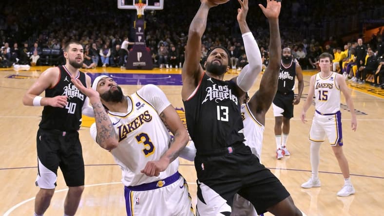 Jan 7, 2024; Los Angeles, California, USA; Los Angeles Clippers forward Paul George (13) shoots over Los Angeles Lakers forward Anthony Davis (3) in the second half at Crypto.com Arena. Mandatory Credit: Jayne Kamin-Oncea-USA TODAY Sports