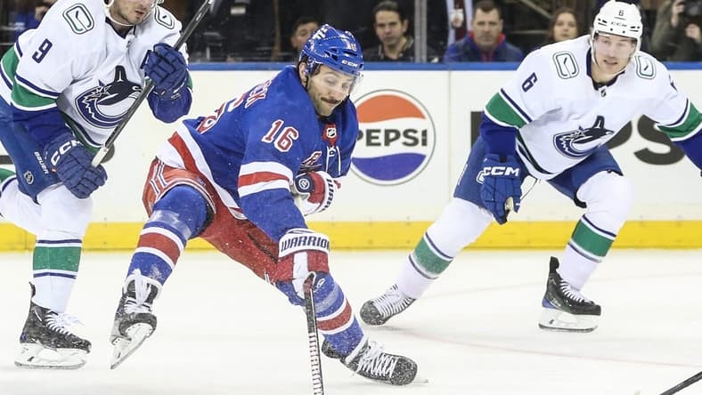 Jan 8, 2024; New York, New York, USA; New York Rangers center Vincent Trocheck (16) controls the puck in the first period against the Vancouver Canucks at Madison Square Garden. Mandatory Credit: Wendell Cruz-USA TODAY Sports