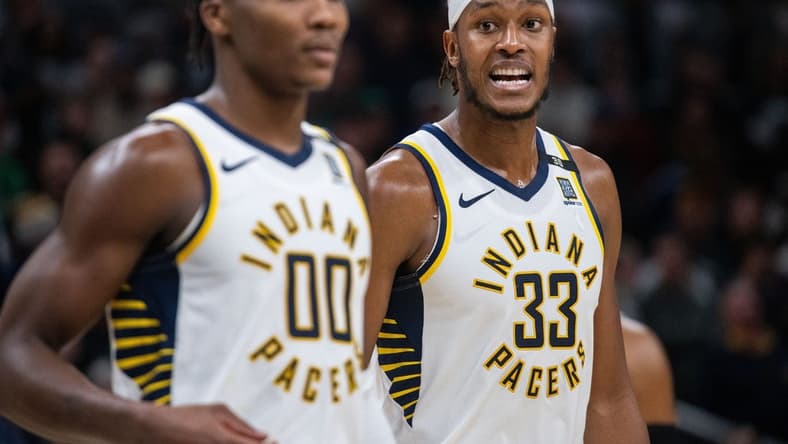 Jan 8, 2024; Indianapolis, Indiana, USA; Indiana Pacers center Myles Turner (33) talks to guard Bennedict Mathurin (00) after a timeout in the second half against the Boston Celtics at Gainbridge Fieldhouse. Mandatory Credit: Trevor Ruszkowski-USA TODAY Sports