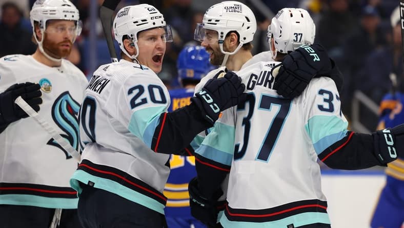 Jan 9, 2024; Buffalo, New York, USA; Seattle Kraken center Yanni Gourde (37) celebrates his goal with teammates during the first period against the Buffalo Sabres at KeyBank Center. Mandatory Credit: Timothy T. Ludwig-USA TODAY Sports